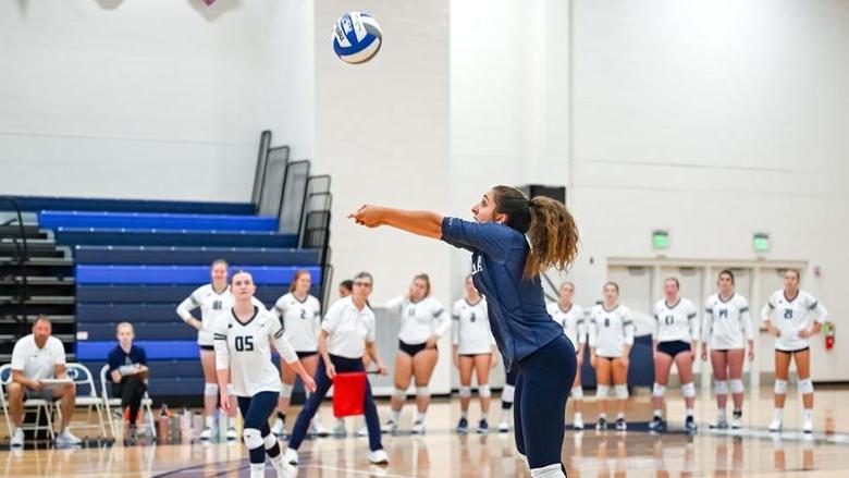 Penn State Altoona volleyball player Anna Batrus hits the ball in a match